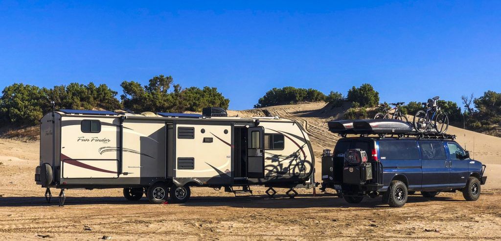 Full Size Conversion Van and Large Tow Behind RV with Solar, Bikes and Gear on a Beach in Mexico